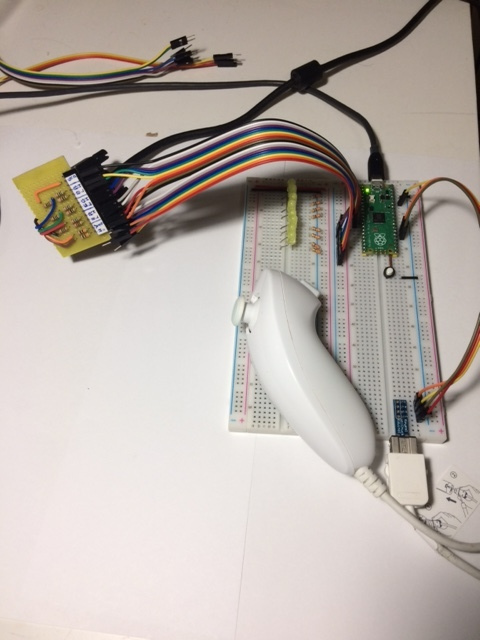 The Pico connected to my homemade DACs and a Wii Nunchuk. Ignore the row of LEDs on the second breadboard, I was using them to debug the output of my PIO program.